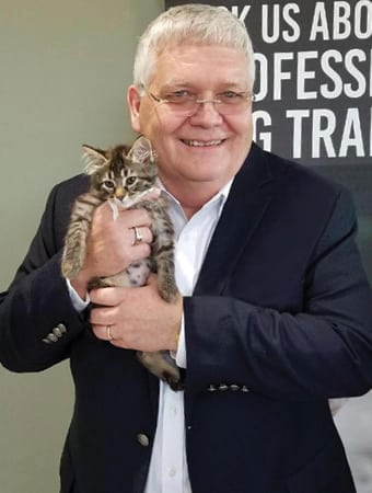 a picture of Dr. Coyne holding a cat